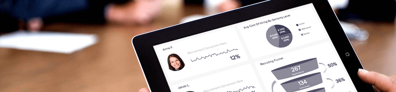HR professional using HR analytics on a tablet
